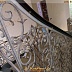 Изогнутая лестница с винтовыми коваными перилами Код: КВЛ-32/93