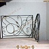 Винтовая лестница с коваными перилами изогнутой формы Код: КВЛ-29/83